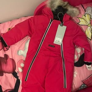 Canada Goose snow suit never worn. Reddish pink